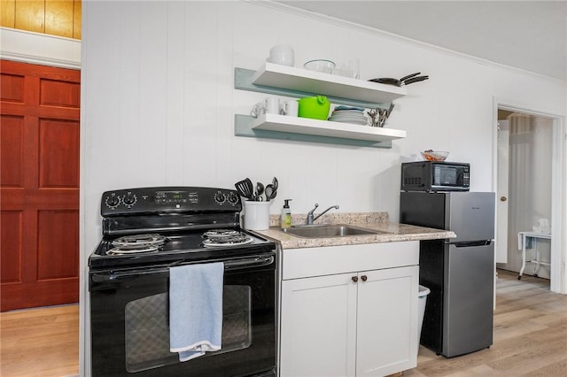 kitchen featuring crown molding, sink, black appliances, light hardwood / wood-style flooring, and white cabinetry