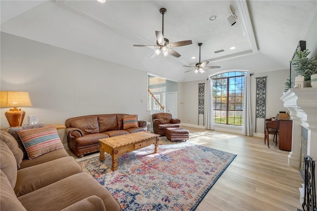 living room featuring light wood-type flooring and ceiling fan