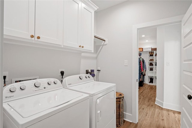 3518 Parmer Creek Ct, College Station, TX 77845 - washroom with cabinet space, washing machine and dryer, light wood-type flooring, and recessed lighting