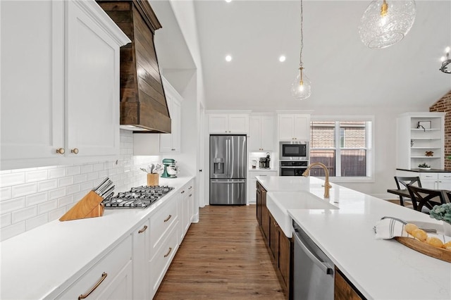 3518 Parmer Creek Ct, College Station, TX 77845 - kitchen with stainless steel appliances, lofted ceiling, hanging light fixtures, light countertops, and tasteful backsplash