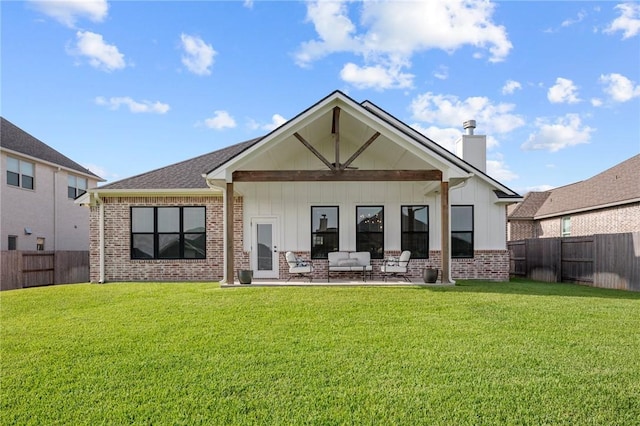 3518 Parmer Creek Ct, College Station, TX 77845 - rear view of property featuring brick siding, a chimney, a fenced backyard, and board and batten siding