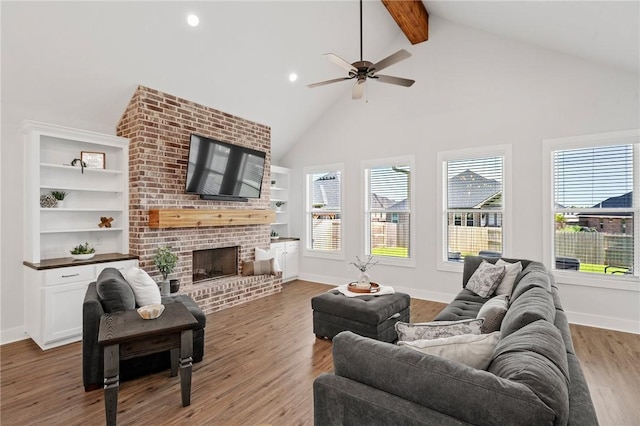 3518 Parmer Creek Ct, College Station, TX 77845 - living room featuring healthy amount of natural light, beamed ceiling, ceiling fan, high vaulted ceiling, and a fireplace