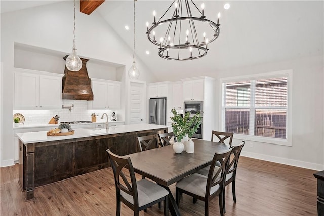 3518 Parmer Creek Ct, College Station, TX 77845 - dining space featuring high vaulted ceiling, a chandelier, beamed ceiling, wood finished floors, and recessed lighting