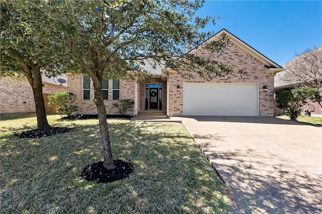 view of front of house with driveway, brick siding, an attached garage, and a front lawn