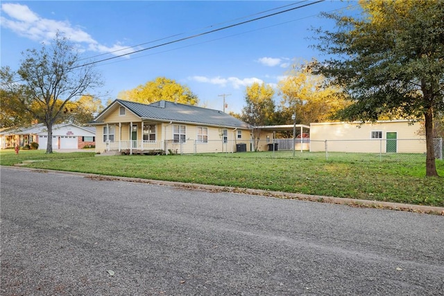 single story home with a porch and a front lawn