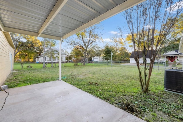 view of yard featuring central air condition unit and a patio