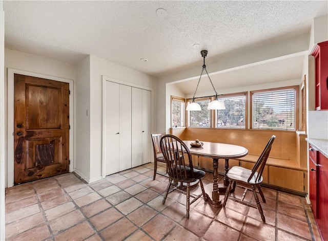 dining room featuring a textured ceiling