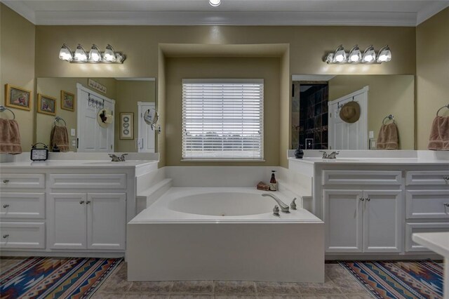 3151 Running River Ln, Washington, TX 77880 - bathroom featuring a garden tub, ornamental molding, and two vanities