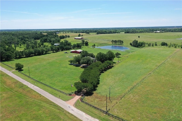 birds eye view of property with a water view and a rural view