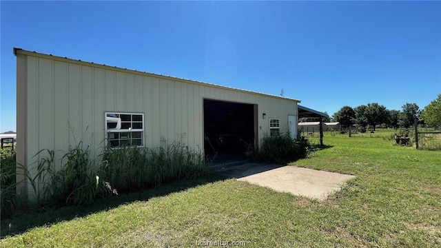 view of outbuilding with a lawn