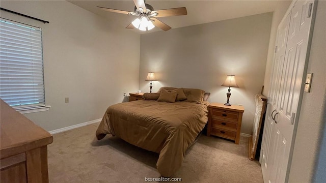 bedroom featuring ceiling fan and light colored carpet