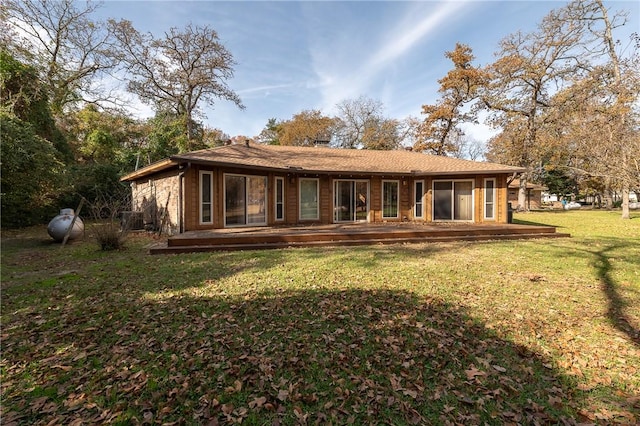 rear view of house with a yard