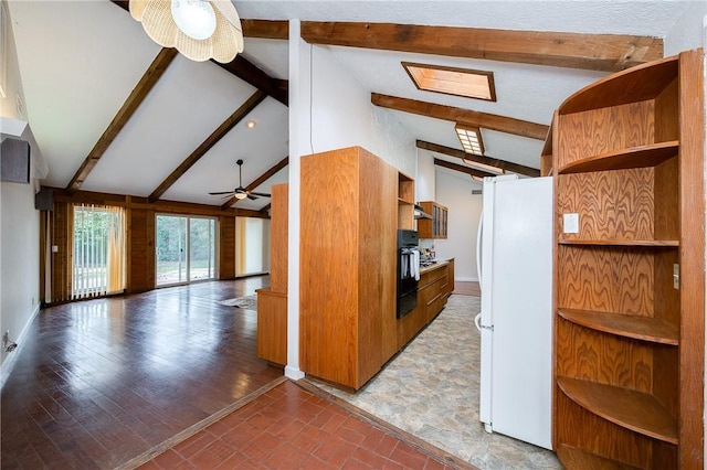 kitchen with white refrigerator, vaulted ceiling with beams, black oven, and ceiling fan