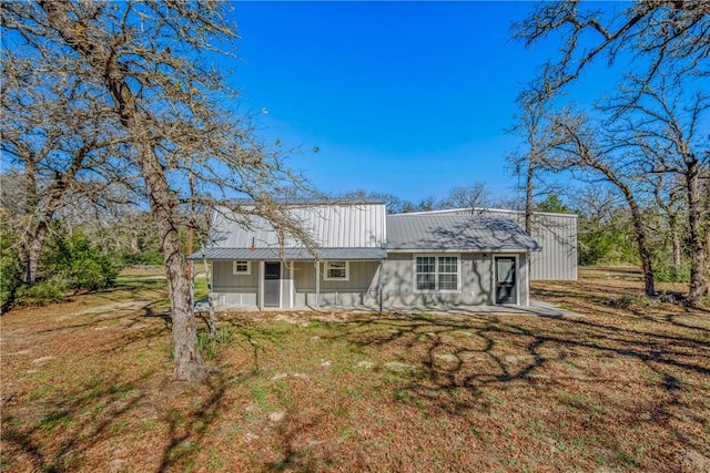 back of house with a yard