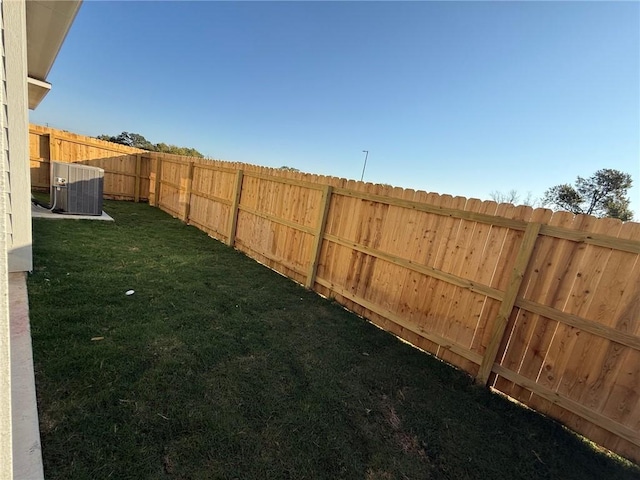 view of yard with central AC unit