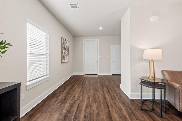 corridor featuring dark wood-type flooring