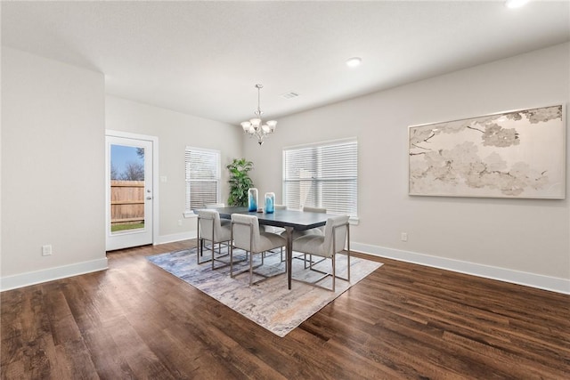 dining space with a chandelier, dark hardwood / wood-style flooring, and a healthy amount of sunlight