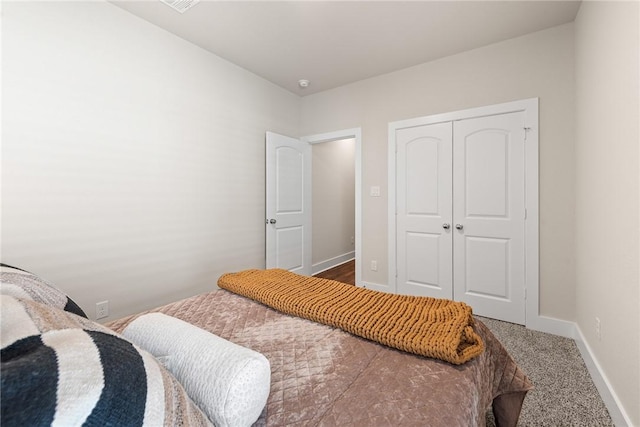 carpeted bedroom featuring a closet