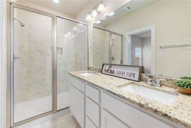 bathroom with vanity and walk in shower