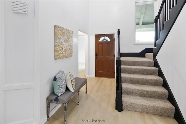 staircase featuring hardwood / wood-style floors