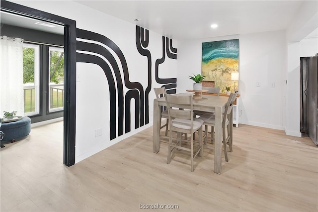 dining room featuring light hardwood / wood-style flooring