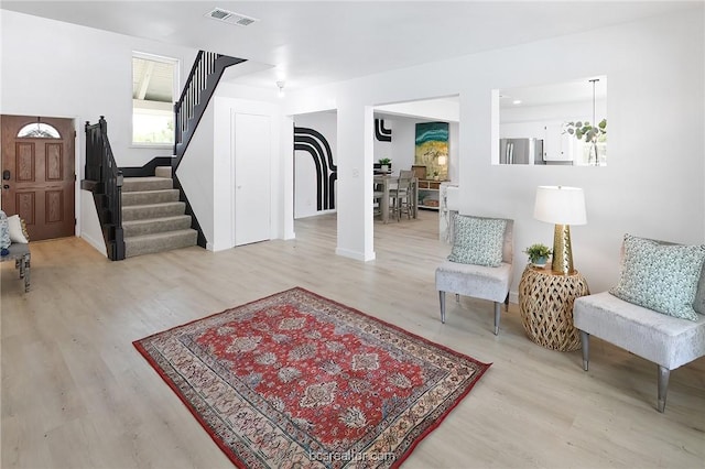 foyer entrance with light hardwood / wood-style flooring