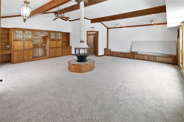 unfurnished living room featuring carpet, lofted ceiling with beams, and ceiling fan