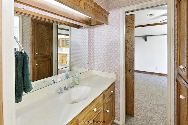 bathroom with vanity and ornamental molding