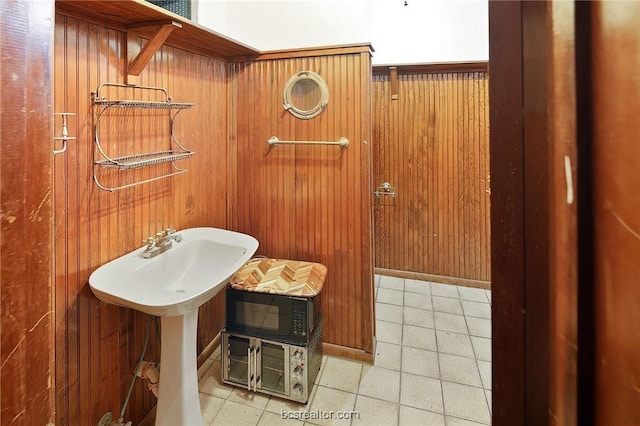 bathroom with wooden walls