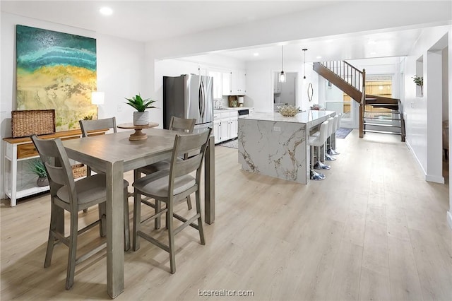 dining room featuring light wood-type flooring