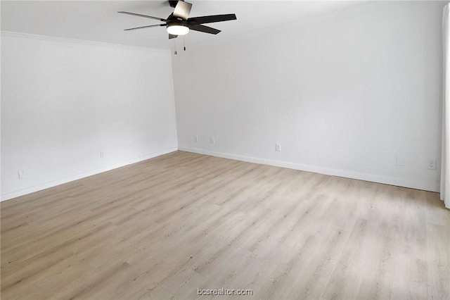 empty room featuring light hardwood / wood-style flooring, ceiling fan, and crown molding