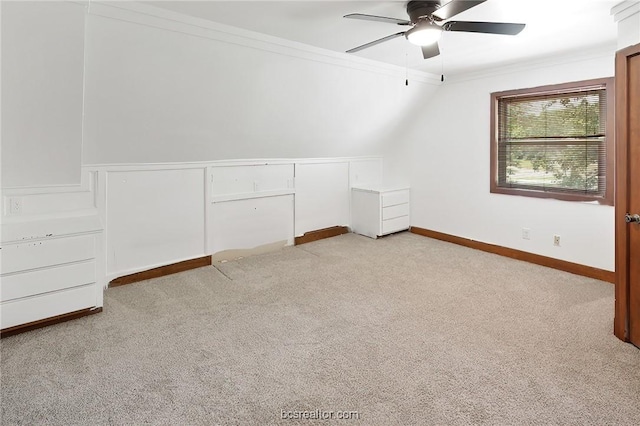 additional living space featuring ceiling fan, light colored carpet, and lofted ceiling