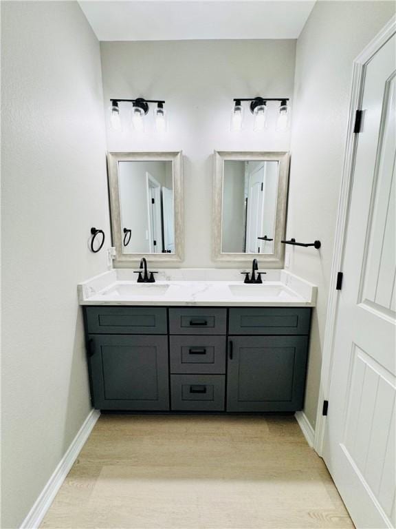 bathroom with vanity and hardwood / wood-style flooring