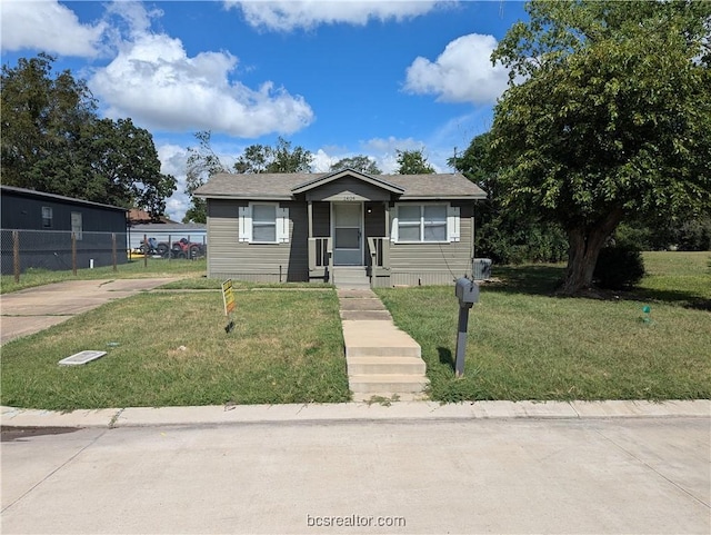 bungalow with a front yard