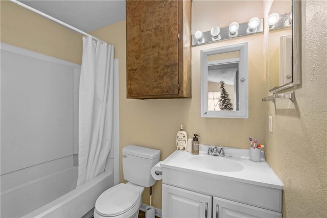 full bathroom featuring shower / tub combo, vanity, and toilet