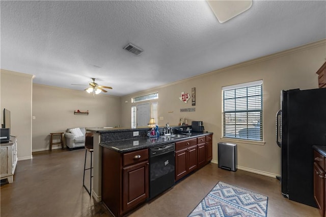 kitchen with sink, a breakfast bar area, crown molding, kitchen peninsula, and black appliances