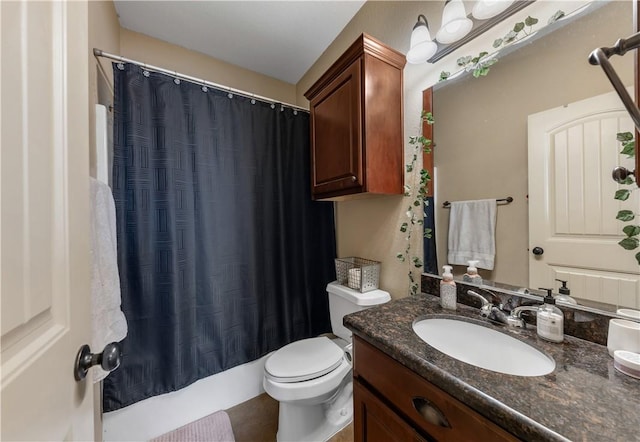 full bathroom featuring shower / bath combo, vanity, and toilet