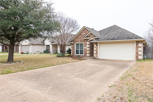 view of front of house featuring a garage and a front lawn