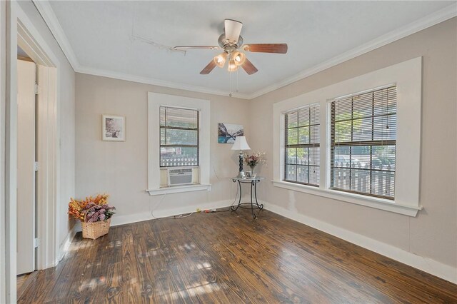 spare room with dark hardwood / wood-style floors, ceiling fan, ornamental molding, and cooling unit