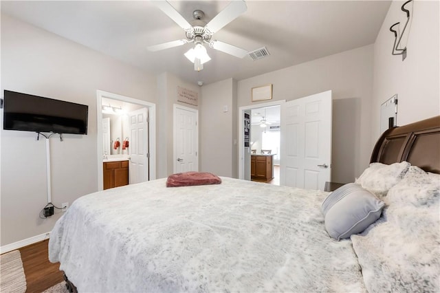 1198 Jones Butler Rd Unit 3103, College Station, TX 77840 - bedroom featuring wood finished floors, ensuite bathroom, baseboards, and ceiling fan