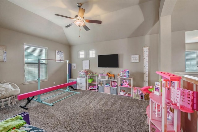 game room with vaulted ceiling, carpet, a healthy amount of sunlight, and ceiling fan