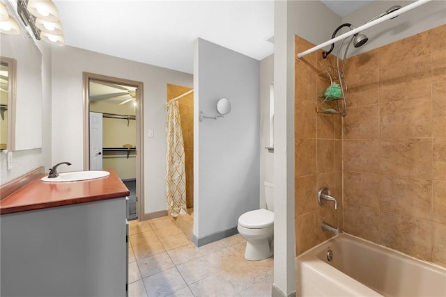 full bathroom featuring tile patterned floors, shower / bathtub combination with curtain, vanity, and toilet