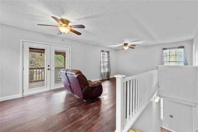 living room with ceiling fan, french doors, and dark wood-type flooring