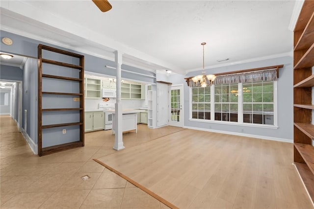 unfurnished living room featuring ceiling fan with notable chandelier, light tile patterned flooring, and crown molding