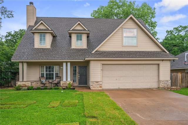 1905 Kingsgate Dr, Bryan, TX 77807 - view of front of home featuring a shingled roof, stone siding, and a chimney