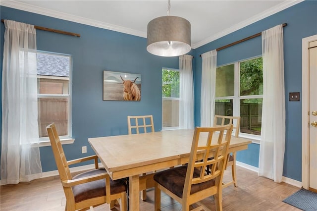 1905 Kingsgate Dr, Bryan, TX 77807 - dining space with baseboards, light wood-style floors, and ornamental molding