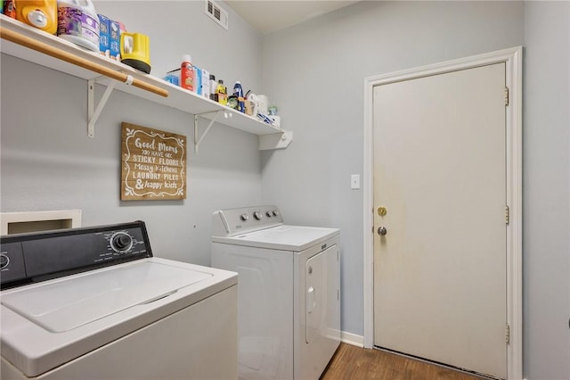 1905 Kingsgate Dr, Bryan, TX 77807 - washroom with washing machine and clothes dryer, wood finished floors, and baseboards