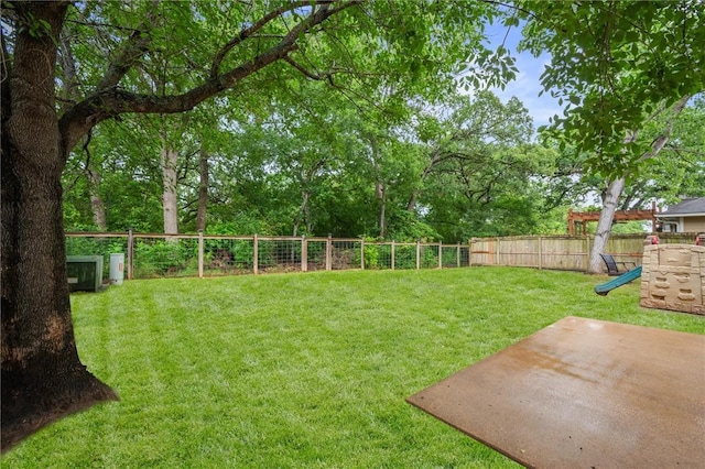 1905 Kingsgate Dr, Bryan, TX 77807 - view of yard featuring a patio, a playground, and view of scattered trees