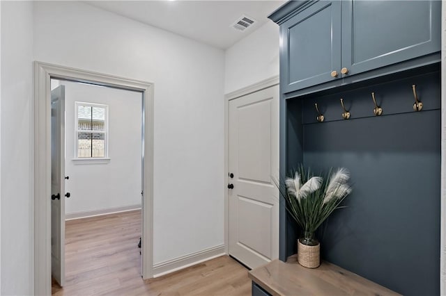 mudroom featuring light wood-style floors and visible vents