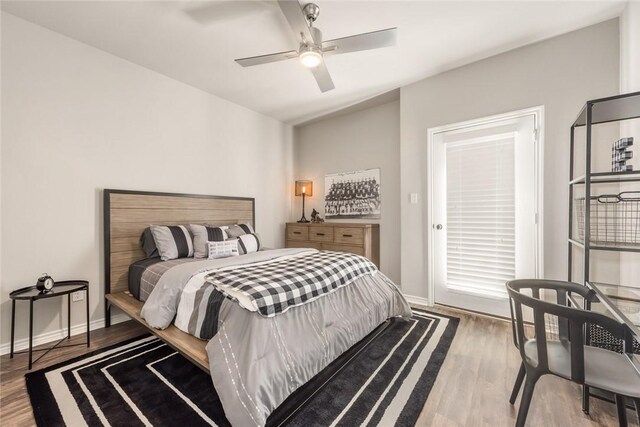 bedroom featuring wood-type flooring, access to outside, and ceiling fan